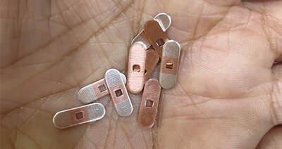 Loingsiú le haghaidh stampála déanta ag stiall inleagtha airgid